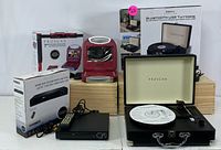 Photo showing the Proscan branded Bluetooth USB turntable, HDMI DVD player with remote, and small red retro toaster oven.