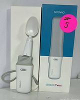 GYENNO Bravo Twist spoon with handle and packaging showing the spoon attachment and box