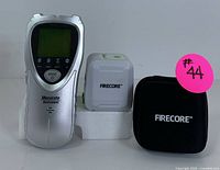 Mecurate stud finder, Firecore laser level, Firecore black zippered carrying case shown front facing
