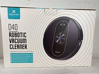 Boxed Denkee D40 Robotic Vacuum Cleaner showing model details and key features on packaging.