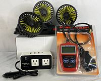 Power inverter, MaxiScan MS309 scanner in packaging, and portable 3-head car cooling fan on white box