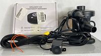Wired car rear view camera with attached long black cable, alongside compact electric pump components.