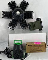Top view of the 100W LED garage light with six adjustable black panels, Diivoo watering timer in dark green with dial, submersible water pump with attached power cord, and boxed digital level.