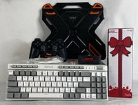 Full lot of gaming keyboard, laptop stand, gaming controller, and boxed karaoke microphone.