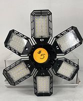 Top view showing the six LED panels with visible LED bulbs and black protective frames.