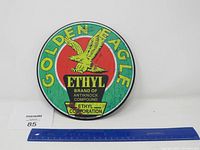 Round metal sign showing the full front face with measurement for size reference.