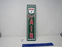 Full front view of the vertical rectangular Sinclair Free Air metal sign showing overall condition and design.