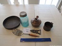 Overview image showing all six items of the vintage lot on a table with ruler for scale.