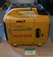 Front view of yellow Kipor IG2000 generator showing housing and control panel