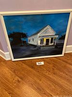 Front view of framed painting showing U.S. Post Office building at night
