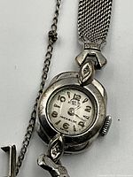 Front view of watch case and dial showing Arabic numerals and Incabloc marking