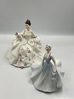 Photo of both figurines together showing scale and detail