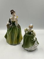 Front view of both Royal Doulton figurines together showing size and detailing