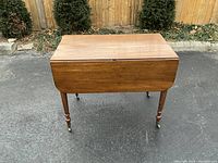 Full front view of table with both drop leaves down