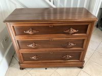 Full front view of walnut dresser showing three drawers and overall condition