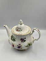 Full front view of teapot with lid on