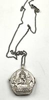 Full view of the silver necklace with Ganesh pendant against a white background, showing chain length and pendant design.
