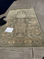 Full view of the 5'x8' Kaleen Woolmark area rug showing overall condition and pattern.