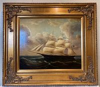 Full view of framed oil painting showing clipper ship on ocean under cloudy sky, with ornate gilt frame.