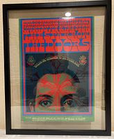 Frontal view of the framed psychedelic concert poster featuring The Doors and others, showing colors and overall condition.