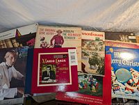 Photo showing eight vintage Christmas vinyl records with various artists and holiday themes, some titles visible including Gene Autry, Mario Lanza, Perry Como, St. Michael's Choir.