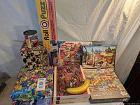 Full display of all puzzles and puzzle roller with banana for scale