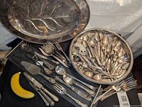 Full display of all utensils and trays including a banana for scale