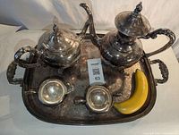 Full set on tray including coffee pot, teapot, cream pitcher, sugar bowl, and banana for size comparison.