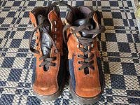 Front view of the Dr. Martens Ground Canyon boots in brown and black suede and leather.