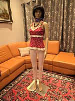 Full body image of mannequin in living room with detailed setting