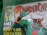 Close-up of comic book cover showing character and price sticker 75 cents 1986
