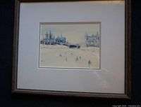 Full view of the framed print showing ice skating scene with buildings and bridge in winter.