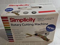 Original product box showing Simplicity rotary cutting machine branding and product features.