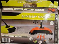 Box of Sweep Smart magnetic broom showing some damage but highlighting key features: use on tiles, hardwood, marble, laminate floors. Magnetic rubbish broom with 360-degree rotation for easy cleaning.
