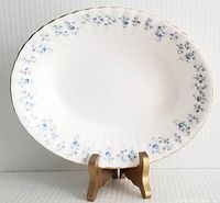 Full view of the 9 inch oval vegetable bowl showing floral pattern and gold rim.