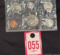 Photo of sealed 1969 Canada proof like 6 coin set showing coins in clear plastic packaging with catalog sticker #055.