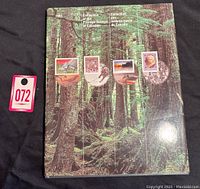 Front cover of the 1993 Canada Post Stamp Collection hardcover album showing forest imagery, 5 example stamps, and text in English and French.