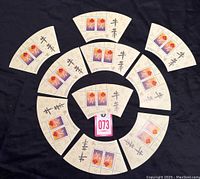 Top view of all 10 fan-shaped miniature sheets with two stamps each, arranged in a circle.