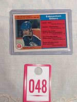 Front of Wayne Gretzky 1981-82 O-Pee-Chee hockey card #99 showing player portrait, Edmonton Oilers team info, and individual scoring leader stats