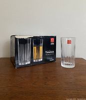 Box of 6 RCR Christalleria Italiana Timeless crystal tumblers with one tumbler outside the box