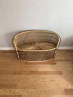 Front view of entire loveseat showing shape and weaving pattern