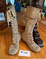 Front view of paired boots showing lacing, toe shape and overall silhouette.