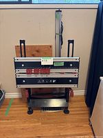 Front view of Black & Decker Workmate 400 with LED worklight and wooden workbench panel behind