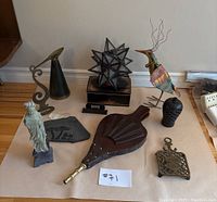 Overview of all decorative items on paper including bellows, figurines and metal ornaments
