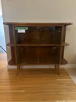 Front view showing sliding glass doors and overall cabinet design