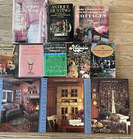 Overview of all 11 books on a wooden floor showing titles and cover images
