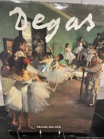 Front cover of the book showing ballerinas in a rehearsal by Degas with title in bold white script.