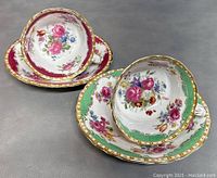 Two sets of vintage floral porcelain teacups with matching saucers, showing detailed floral patterns and gold trim.