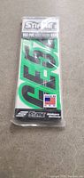 Front view of new green Stiffie boat/vehicle registration decal stickers in original sealed packaging with label showing part number G552.