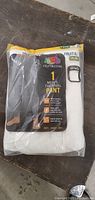 Front view of Fruit of the Loom XL men's thermal pants in packaging showing product label and colors.